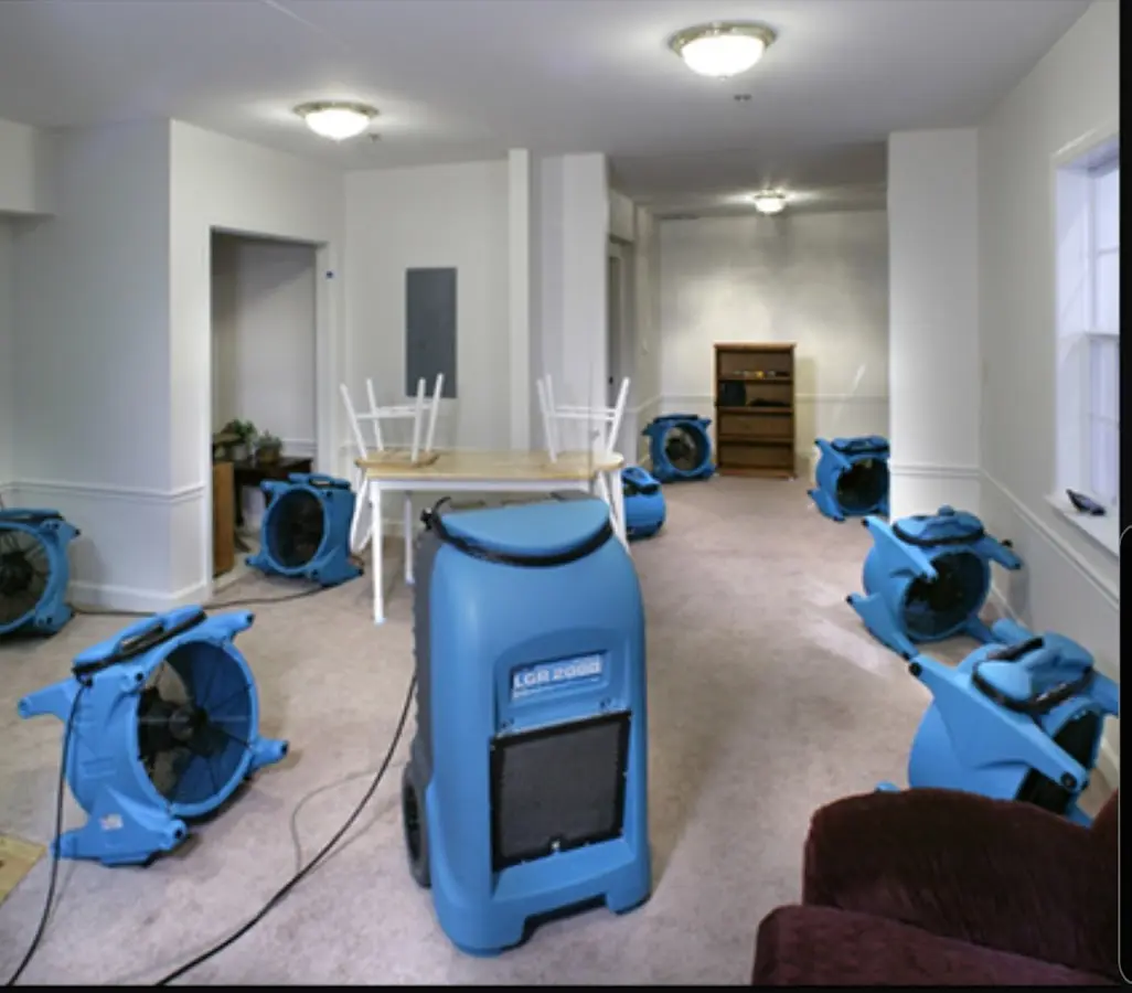 Air movers and dehumidifier setup for Water Damage Restoration in College